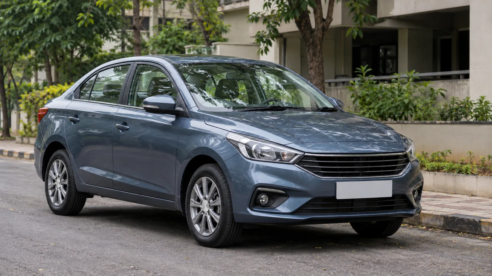 Generic unbranded steel-blue compact sedan parked on a leafy Pune residential street, illustrative scene