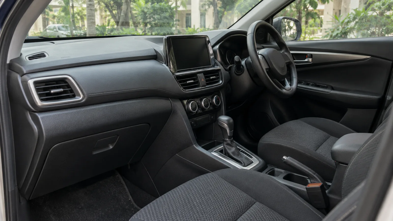 Illustrative unbranded right-hand-drive compact SUV cabin with an automatic gear selector