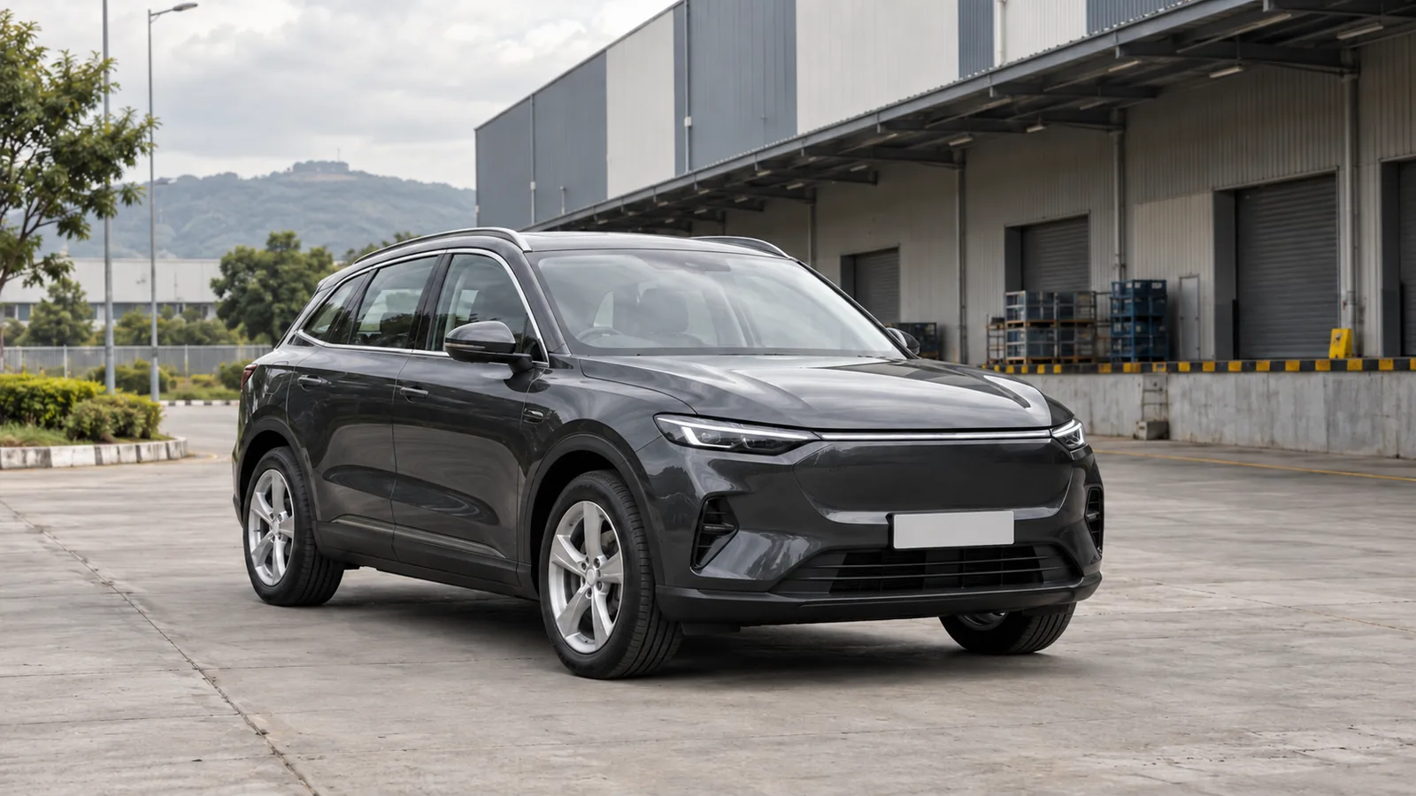 Illustrative unbranded graphite electric crossover at an Indian industrial logistics forecourt