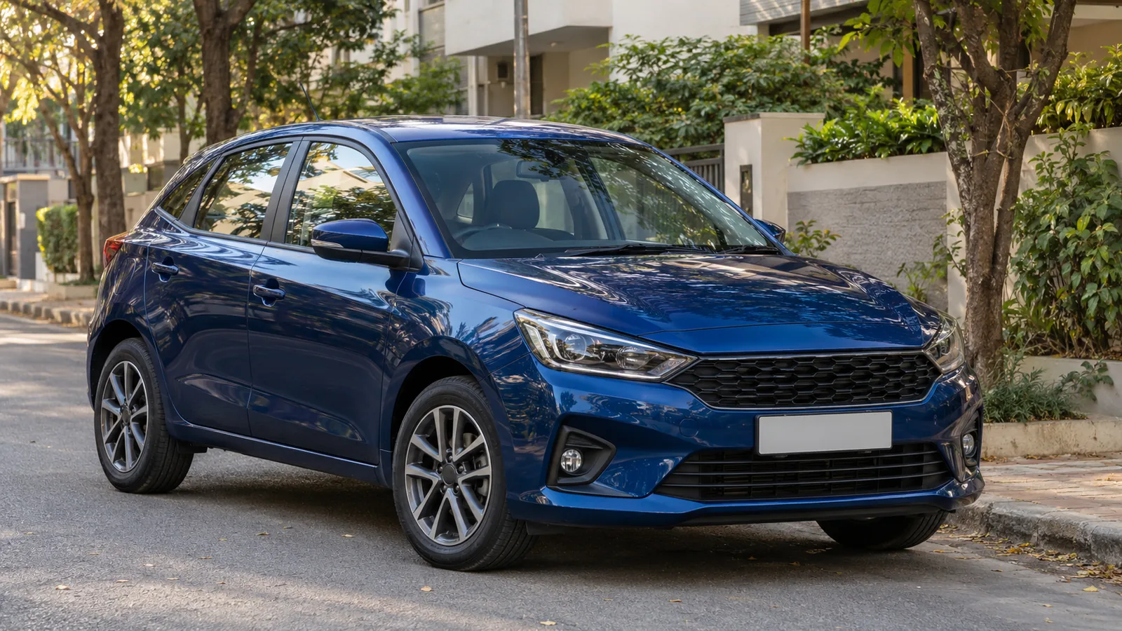 Illustrative unbranded blue premium hatchback parked on a quiet Bengaluru residential lane