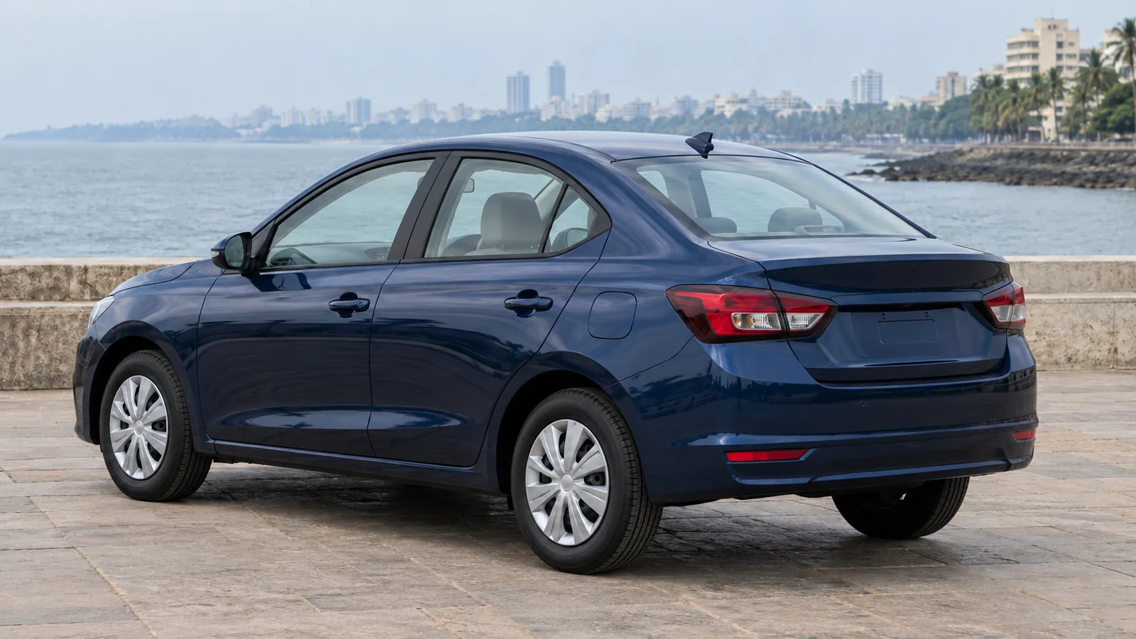 AI-generated generic unbranded midnight-blue sedan beside an Indian coastal promenade, not the Volkswagen Virtus or an official Volkswagen design